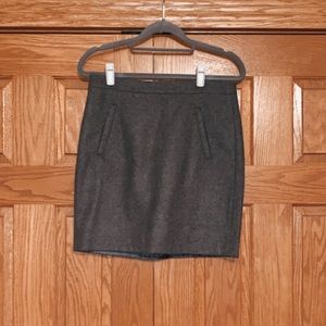 gray skirt, back zipper, front zip pockets